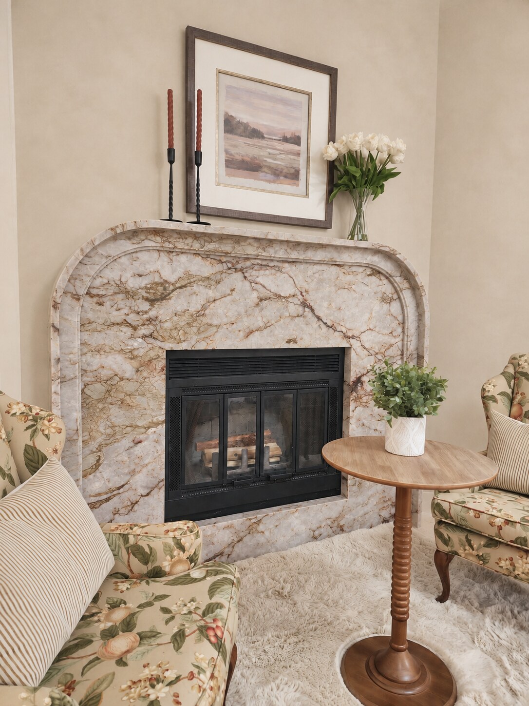 Collected fireplace corner with floral chairs styled by Housewise Studios